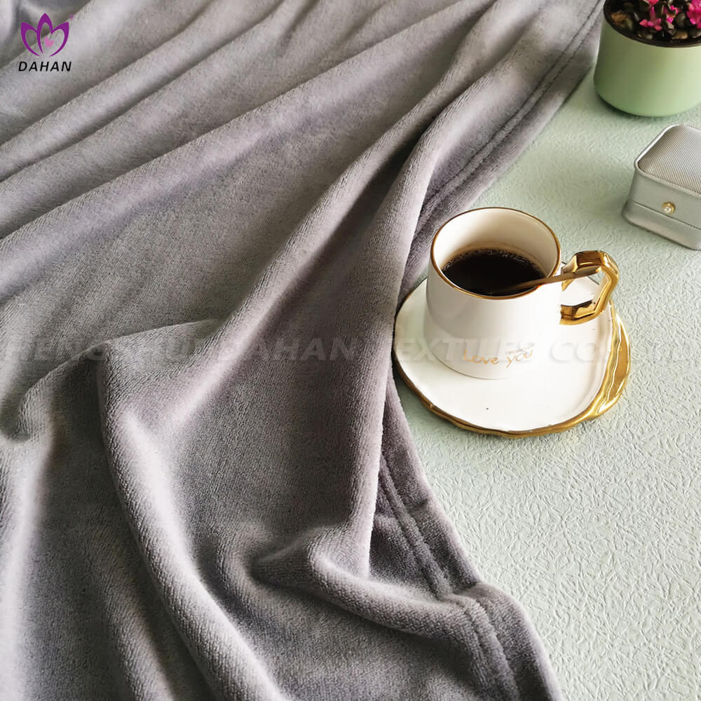 Solid color coral fleece blanket.